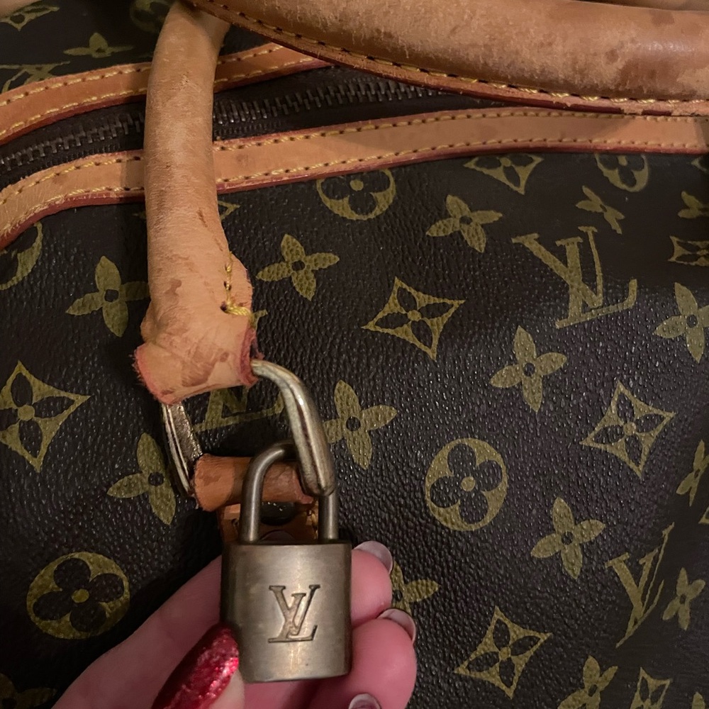 Louis Vuitton duffle bag. Good condition. Selling with original cloth bag.